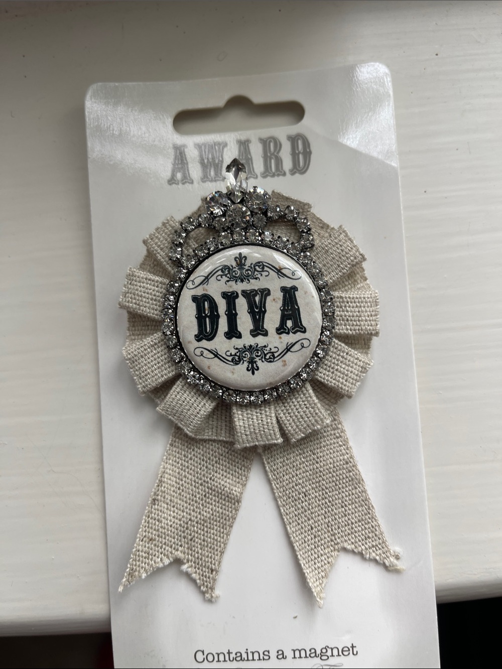 DIVA Ribbon Badge Pin in Cream with Silver Accents